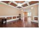 Refined dining room with coffered ceilings, hardwood floors, and decorative wall paneling at 1340 Delo Ln, Cumming, GA 30041