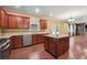 Modern kitchen with stainless steel appliances, granite countertops, and center island at 1340 Delo Ln, Cumming, GA 30041