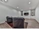 Basement room with accent lighting and built-in shelving features a TV and seating for entertaining at 139 Grandmar Chase, Canton, GA 30115