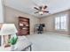 Bedroom with a ceiling fan, window with shutters, bookshelf and desk at 139 Grandmar Chase, Canton, GA 30115
