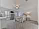 Comfortable bedroom with a ceiling fan, soft carpeting and a cozy bed at 139 Grandmar Chase, Canton, GA 30115