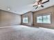 Spacious bedroom features neutral walls, plush carpet, ceiling fan, and windows offering natural light at 139 Grandmar Chase, Canton, GA 30115