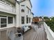 Spacious outdoor deck area with a seating arrangement and a view of the backyard at 139 Grandmar Chase, Canton, GA 30115