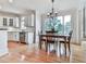 Charming dining area adjacent to bright kitchen with stainless steel appliances and a sunny window view at 139 Grandmar Chase, Canton, GA 30115