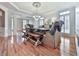 Charming dining room featuring hardwood floors, large windows, and stylish furniture at 139 Grandmar Chase, Canton, GA 30115