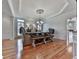 Elegant dining room with hardwood floors, stylish chandelier, and decorative ceiling at 139 Grandmar Chase, Canton, GA 30115