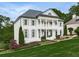 Elegant two-story home with a beautifully landscaped front yard and classic architectural details at 139 Grandmar Chase, Canton, GA 30115