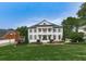 Stately two-story home with a manicured lawn and lush landscaping at 139 Grandmar Chase, Canton, GA 30115