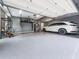 Clean and organized garage with epoxy flooring, ample storage, and space for multiple vehicles at 139 Grandmar Chase, Canton, GA 30115