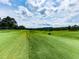 Expansive view of the lush green Woodmont Golf Course, ideal for golfing enthusiasts at 139 Grandmar Chase, Canton, GA 30115