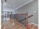 Upstairs hallway with hardwood floors, decorative railings, and neutral paint at 139 Grandmar Chase, Canton, GA 30115