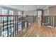 Open hallway overlooking entryway with hardwood floors and wrought iron railing at 139 Grandmar Chase, Canton, GA 30115