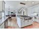 Spacious kitchen with a large island, granite countertops, stainless steel appliances, and open floor plan at 139 Grandmar Chase, Canton, GA 30115
