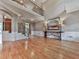 Spacious living room featuring hardwood floors, high ceilings, and decorative molding at 139 Grandmar Chase, Canton, GA 30115
