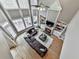 Aerial view of living room with a fireplace, built-in shelving, hardwood floors, and a comfortable brown sectional sofa at 139 Grandmar Chase, Canton, GA 30115