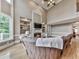 Living room features a fireplace, built-in shelving, hardwood floors, and large windows overlooking the deck at 139 Grandmar Chase, Canton, GA 30115