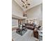 Inviting living room features vaulted ceilings, large windows, hardwood floors, and a comfortable brown sectional sofa at 139 Grandmar Chase, Canton, GA 30115