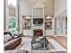 Cozy living room with hardwood floors, fireplace, built-in shelves, and comfortable seating at 139 Grandmar Chase, Canton, GA 30115