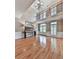 Well-lit living room featuring hardwood floors, large windows, and stylish decor at 139 Grandmar Chase, Canton, GA 30115
