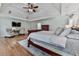 Inviting main bedroom featuring a trey ceiling, hardwood floors, and a sitting area at 139 Grandmar Chase, Canton, GA 30115
