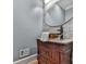 Stylish powder room with a vessel sink, stone tile accent wall, and modern fixtures at 139 Grandmar Chase, Canton, GA 30115