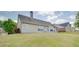 Exterior backyard of home with landscaped yard at 4217 Brentwood Dr, Buford, GA 30518