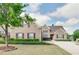 Attractive two-story brick home showcasing lush green lawn and mature trees in a desirable neighborhood at 4217 Brentwood Dr, Buford, GA 30518