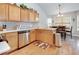 Well-lit kitchen featuring stainless steel appliances, ample cabinetry, and a cozy dining area with plenty of space at 4217 Brentwood Dr, Buford, GA 30518