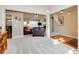 Open-concept living space showcasing wood and carpet flooring, modern lighting, and a comfortable seating area at 4217 Brentwood Dr, Buford, GA 30518
