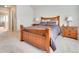 Cozy bedroom featuring neutral walls, carpet flooring and decorative wood furniture set at 4217 Brentwood Dr, Buford, GA 30518