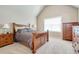Comfortable primary bedroom featuring large windows, neutral walls, and matching wood furniture at 4217 Brentwood Dr, Buford, GA 30518