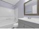 Modern bathroom with a shower-tub combination, vanity, and updated fixtures at 6597 Ivy Log Dr, Austell, GA 30168