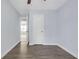 This bedroom has light blue walls, wood-look flooring, and white doors at 6597 Ivy Log Dr, Austell, GA 30168