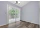Bright dining area with wood floors and sliding door to a backyard deck at 6597 Ivy Log Dr, Austell, GA 30168