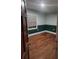 Bright bedroom featuring wood floors, painted walls and a window at 3238 Washington Rd, Atlanta, GA 30344