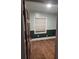 Cozy bedroom featuring two-tone walls, wood floors, and a window with natural light at 3238 Washington Rd, Atlanta, GA 30344
