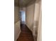 Hallway with wood flooring, white paint, and detailed trim at 3238 Washington Rd, Atlanta, GA 30344