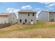 Back view of home featuring a backyard with a grassy area at 3475 Ridge Hill Pkwy, Douglasville, GA 30135