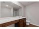 Bathroom features a sleek vanity with solid surface countertop, toilet, and a large mirror at 3475 Ridge Hill Pkwy, Douglasville, GA 30135