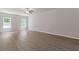 Spacious bedroom featuring ample natural light, ceiling fan, and neutral walls and flooring at 3475 Ridge Hill Pkwy, Douglasville, GA 30135
