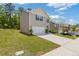 Exterior side view of a cozy home with a well-maintained lawn, a driveway, and an attached two-car garage at 3475 Ridge Hill Pkwy, Douglasville, GA 30135