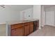 Kitchen island features granite counters, sink, dark wood cabinets, and stainless steel dishwasher at 3475 Ridge Hill Pkwy, Douglasville, GA 30135