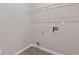 Bright laundry room with white walls, flooring, and hookups for laundry appliances at 3475 Ridge Hill Pkwy, Douglasville, GA 30135