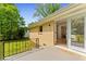 Back patio featuring a metal railing with easy access to the interior through sliding glass doors at 4002 Lindsey Dr, Decatur, GA 30035