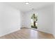 Neutral bedroom with light wood flooring and a window offering natural light and outdoor views at 4002 Lindsey Dr, Decatur, GA 30035