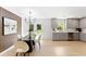 Dining room with gray cabinets, stainless steel appliances and door to backyard at 4002 Lindsey Dr, Decatur, GA 30035