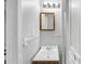 This bathroom features a small vanity, mirror, and light at 844 Oak Nw St, Atlanta, GA 30318