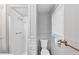 This small bathroom features a toilet, shower, and small window at 844 Oak Nw St, Atlanta, GA 30318