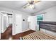 This bedroom features hardwood floors, light gray walls, and an ensuite bathroom at 844 Oak Nw St, Atlanta, GA 30318