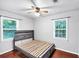 This simple bedroom features a bare bed frame with wood floors and light gray walls at 844 Oak Nw St, Atlanta, GA 30318